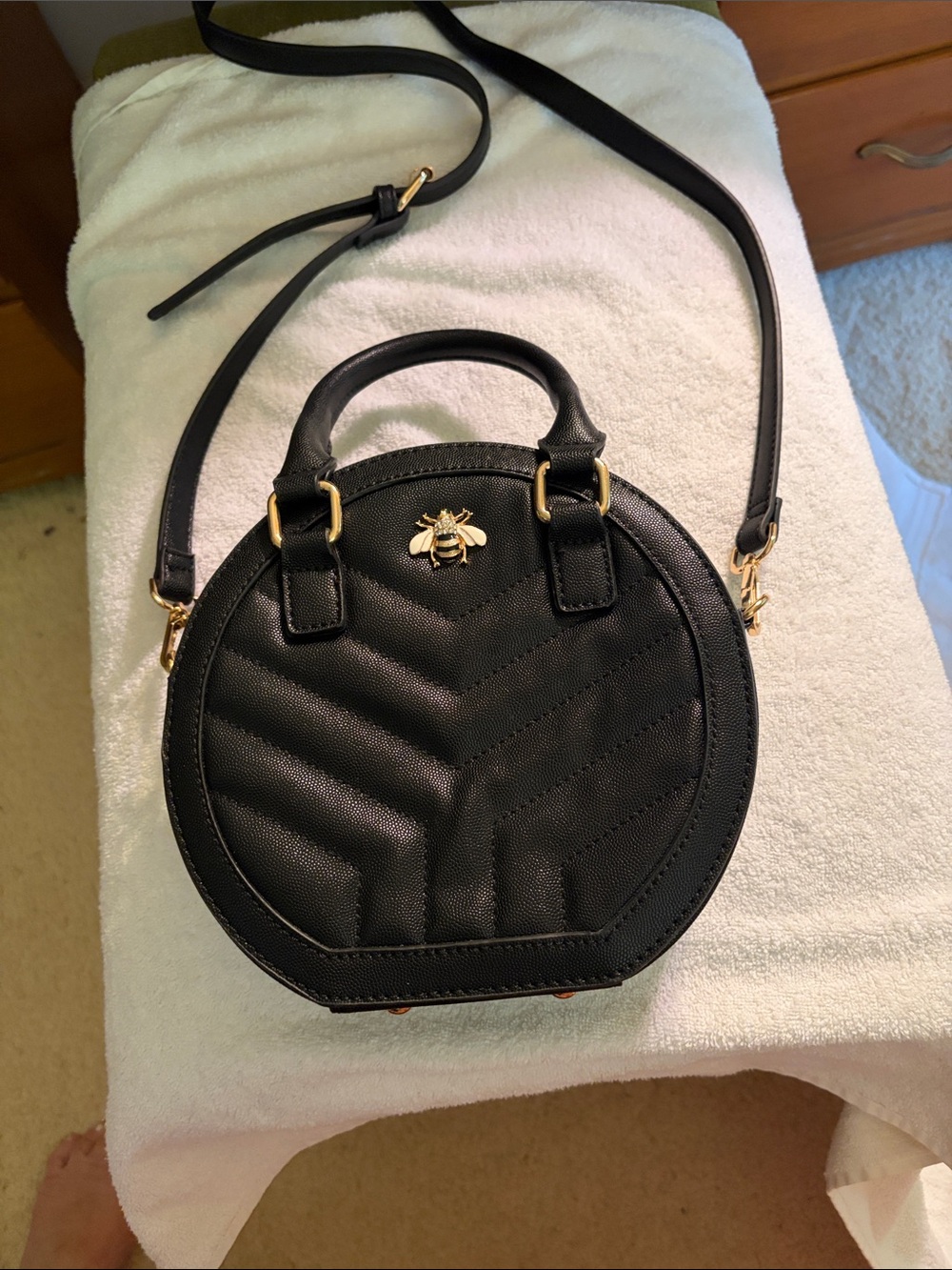 Quilted Black Round Crossbody Bag with Gold Bee Accent